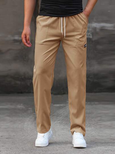 Manfinity Homme سروال رجالي عريض القصة واسع الساقين مع لصقات أحرف وخصر برباط