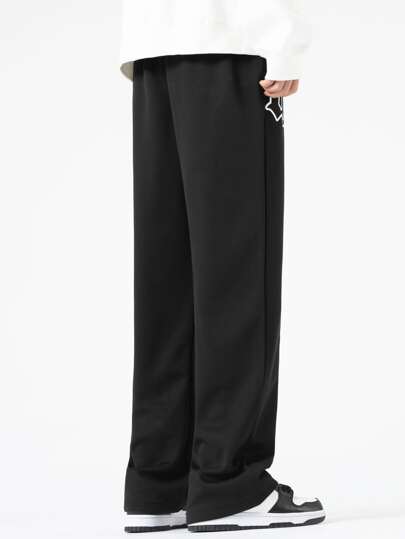 Manfinity Sporsity بنطلون رجالي فضفاض بخصر أربطة وجرافيك حرفي