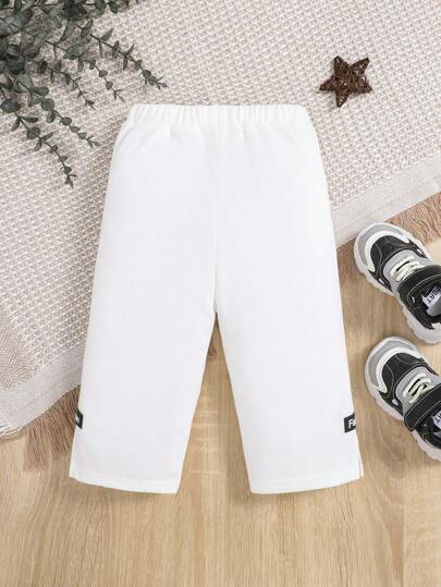 SHEIN بنطلون تفاصيل مرقع بعبارة رباط خصر للاولاد الاطفال