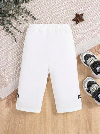 SHEIN بنطلون تفاصيل مرقع بعبارة رباط خصر للاولاد الاطفال