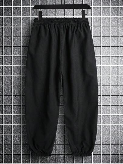 Manfinity Hypemode بنطلون رجالي ذو قَصَّة فضفاضة بألوان سادة وأسلوب فرنكو طويل واسع للخروجات بلون أسود