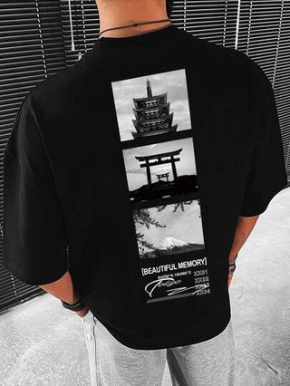 Manfinity Homme تي شيرت منخفض الاكتاف بطباعة شعار للرجال