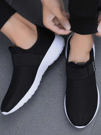 حذاء رياضي أسود خفيف الوزن ومريح وتصميم عصري للرجال، حذاء عملي أنيق للأعمال والنشاطات الخارجية، مضاد للانزلاق عند الركض