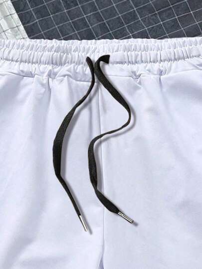 Manfinity Homme بنطلون قصير بطباعة أحرف رباط خصر للرجال