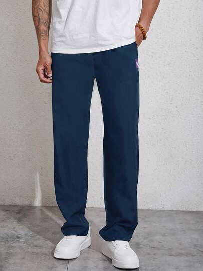 Manfinity Homme بنطلون تفاصيل مرقع بعبارة رباط خصر للرجال