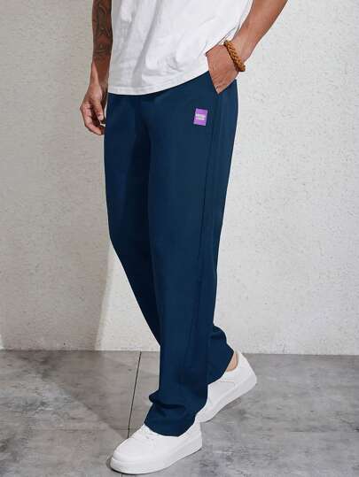 Manfinity Homme بنطلون تفاصيل مرقع بعبارة رباط خصر للرجال