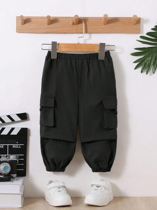 SHEIN بنطلون هاريم ناعم وخفيف بألوان أحادية للأطفال الصبيان مع جيوب مغطاة بغطاء جانبي