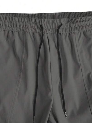 Manfinity LEGND بنطلون شحن رجالي فضفاض مع جيوب ذات حاجز، ياقة جانبية برباط