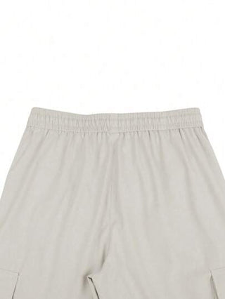 Manfinity Homme بنطال شحن رجالي فضفاض بجيوب تصميم الطية على الأجزاء، و خصر مع رباط