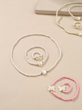 مجموعة عبارة عن 12 قطعة: 1-عقد مجوهرات مطرز / 2- 4أساور / 3- 4خواتم / 4- 4زينات يومية للفتيات