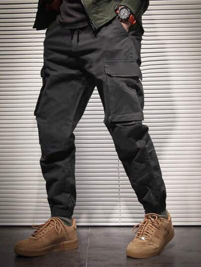 Manfinity Hypemode بنطلونات كارجو واسعة للرجال مع جيوب متعددة