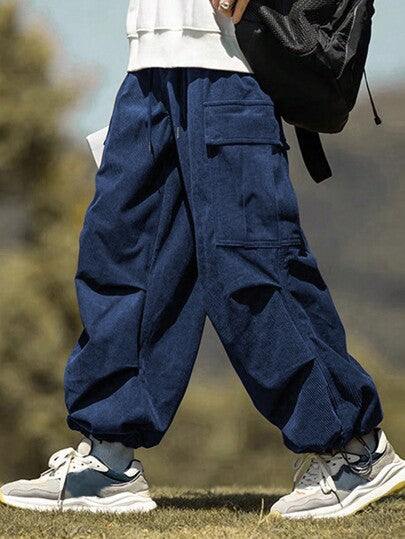 Manfinity Hypemode سروال رجالي بالقماش الكردي الواسع بجيوب