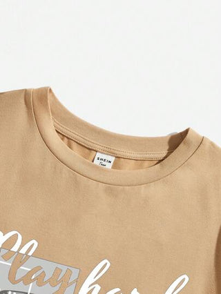 SHEIN قميص صيفي قصير الأكمام برقبة دائرية لفتى العمر الوسطى ذو رسوم كرتونية