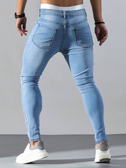 Manfinity LEGND جينز كاجوال بخصر ضيق و مُمزق قطني للرجال أزرق فاتح، بتفاصيل طرفية، ملائم بقصة نحيفة، هدية للزوج أو الحبيب
