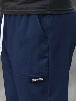 Manfinity Homme بنطلون رجالي مريح بقصة مستقيمة وتصميم جيوب بقطع حروف وخصر برباط