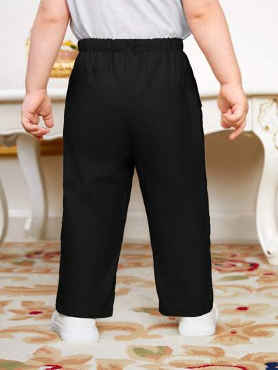 SHEIN سروال طفل صبي عادي بخصر برباط وجيوب مائلة