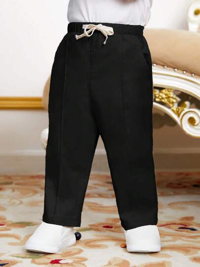 SHEIN سروال طفل صبي عادي بخصر برباط وجيوب مائلة