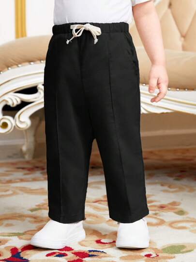 SHEIN سروال طفل صبي عادي بخصر برباط وجيوب مائلة