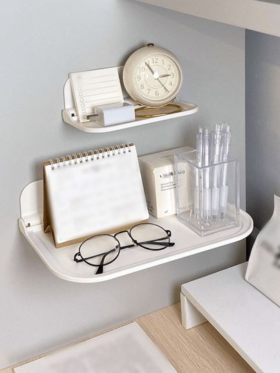 رف عائم من البلاستيك قابل للطي ويتم تثبيته على الحائط بدون الحاجة إلى حفر للتخزين، يستخدم في الحمامات وغرف النوم لتخزين المناشف والملابس