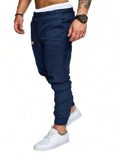 Manfinity Homme بنطال فضفاض للرجال بخصر يربط برباط وجزئيات مرقعة