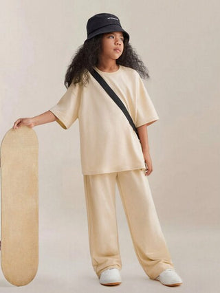 girls-sets تي شيرت قصير الأكمام الواسع الملمس الصلب للفتاة المراهقة المحبوك الذي يتميز بالكتفين المنخفضين مع بنطلون برباط وجيوب مائلة، مجموعة مكونة من قطعتين