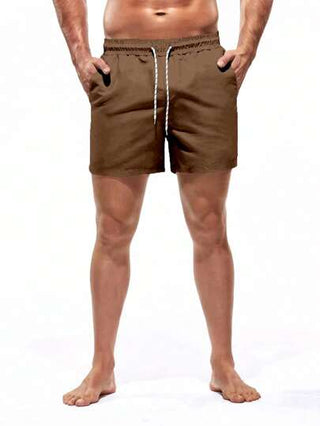 Manfinity Swimmode سروال بحري فضفاض بخصر مطاطي ورباط للرجال ملون بألوان سادة للعطلات