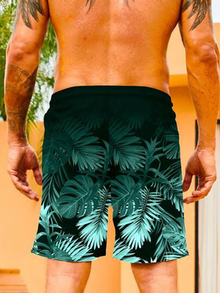Manfinity Swimmode بكمة سباحة رجالية بزخارف استوائية مع خصر ذو رباط معصمي، طراز هاواي