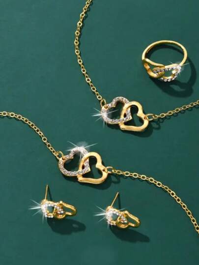 مجموعة عقد ورقبة وخاتم وأقراط واحدة على شكل قلب عصرية، تتضمن سوار و رباط و خاتم وزوج من الأقراط؛ مثالية للحفلات، وهدية رائعة