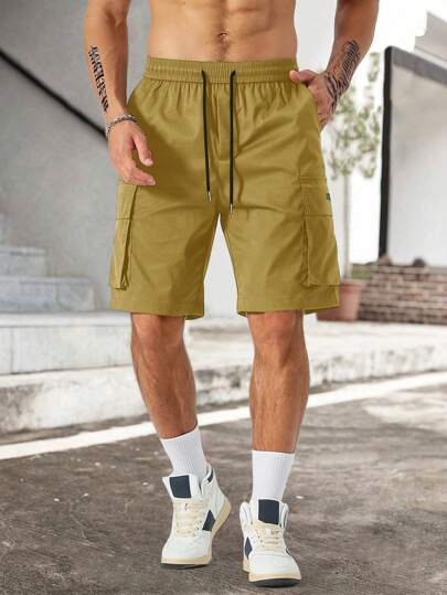 Manfinity Homme شورتات كارجو رجالية فضفاضة المقاس بشراشيب حرفية، جيوب مستطيلة، وخصر برباط