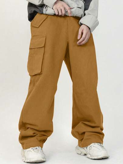 SHEIN سروال بنمط أكاديمية منتجع صبي مستدق جيب فضفاض بنمط سادة نسيج خام مع رقع 3D