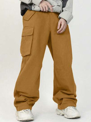 SHEIN سروال بنمط أكاديمية منتجع صبي مستدق جيب فضفاض بنمط سادة نسيج خام مع رقع 3D