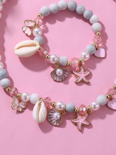 طقم قلادة وأساور ثنائي مكون من لؤلؤ واصداف الفراشة والنجمة البحرية للبنات