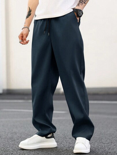 Manfinity Homme بنطلون رجالي أساسي بخصر رباط مستقيم فضفاض عادي