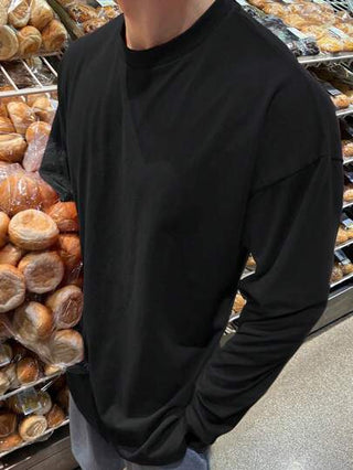 DAZY تي شيرت كاجوال بأكمام طويلة وياقة دائرية قصة فضفاضة للرجال باللون الأسود سادة