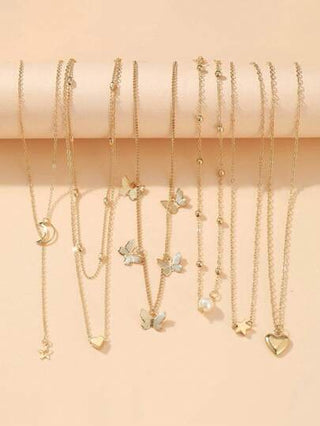 مجموعة 6 قطع قلادات سلسلة غير متناسقة من النجم والقمر والقلب والخرز الزائف واللؤلؤ والفراشة، مجوهرات معدنية متعددة العناصر للفتيات
