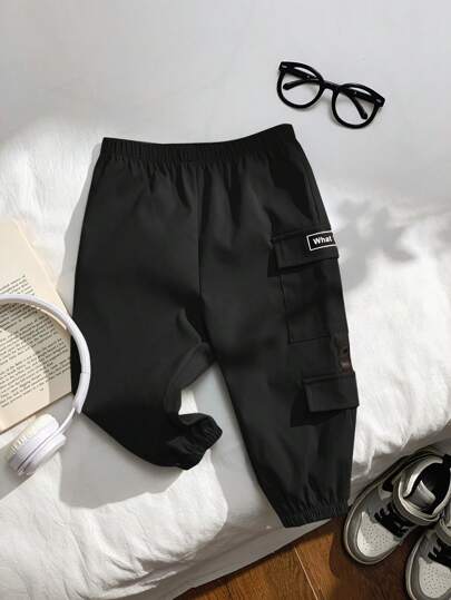 SHEIN بناطيل أطفال بنين/بنات كاجوال متعددة الجيوب بسحاب وزخارف حرف ملائمة للارتداء اليومي والرياضة والأنشطة الخارجية