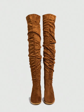 بوت طويلة فوق الركبة ذات كعب سميك من الجلد الأحمر مزودة بسحاب جانبي للنساء موديل 2024