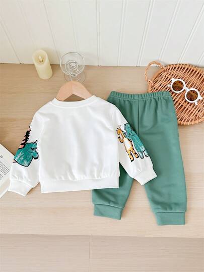 مجموعة من 2 قطعة، شورت وبلوزة كاجوال يومية ناعمة وجميلة بطبعة أشكال الحيوانات الملونة، بياقة دائرية. مناسب للأطفال الخروجات اليومية، وفصلي الخريف والشتاء