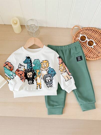 مجموعة من 2 قطعة، شورت وبلوزة كاجوال يومية ناعمة وجميلة بطبعة أشكال الحيوانات الملونة، بياقة دائرية. مناسب للأطفال الخروجات اليومية، وفصلي الخريف والشتاء