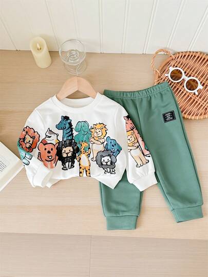 مجموعة من 2 قطعة، شورت وبلوزة كاجوال يومية ناعمة وجميلة بطبعة أشكال الحيوانات الملونة، بياقة دائرية. مناسب للأطفال الخروجات اليومية، وفصلي الخريف والشتاء