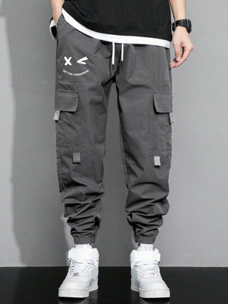 Manfinity Hypemode بنطلون شحن للرجال مزخرف برسومات حرفية مع جيب وسحاب للخصر