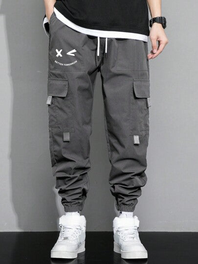 Manfinity Hypemode بنطلون شحن للرجال مزخرف برسومات حرفية مع جيب وسحاب للخصر