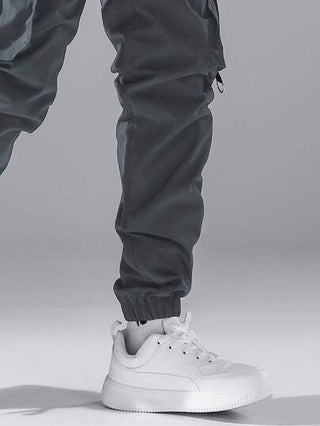 Manfinity Hypemode بناطيل رجالية فضفاضة ذات جيوب على الجانب مزودة بحبل ربط للخصر من نوع البضائع