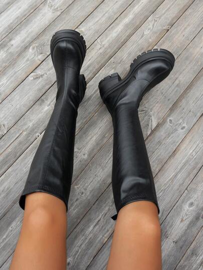 بوت نسائية من الجلد بنصف الساق، ذات كعب سميك مدور بمقدمة مستديرة، مع سحاب خلفي وقاعدة سميكة مقاومة للماء، مناسبة لجميع المواسم، بلون أسود، عصرية للتنقل اليومي والخارج