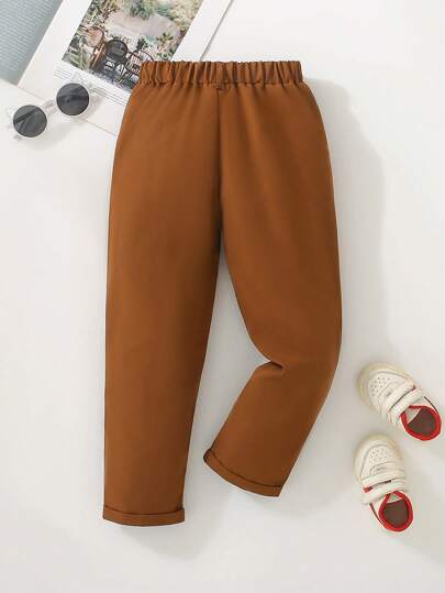 Souflis Souflis بنطلون أطفال أولاد كاجوال أحادي اللون، مزين بزر واحد، جيوب مائلة، تصميم خصر مطاطي، مناسب للارتداء اليومي والسفر والحفلات، متعدد الاستخدامات في الموضة