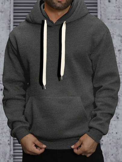 Manfinity Homme هوودي طويل الأكمام أحادي اللون بجيب للرجال كبار الحجم، بتصميم بسيط وكاجوال