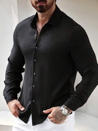 Manfinity Homme قميص كاجوال من القطن بأكمام طويلة ذو موحد اللون بتصميم أحادي الصدر للرجال موسم الخريف