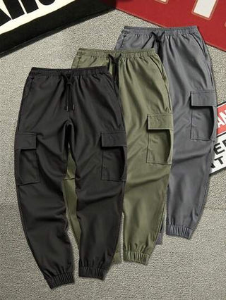 Manfinity Homme بناطيل حمولة رجالية بخصر مطاطي لون سادة