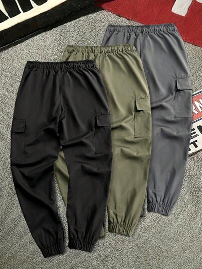 Manfinity Homme بناطيل حمولة رجالية بخصر مطاطي لون سادة