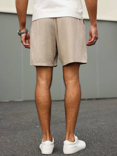 Manfinity Homme شورت كاجوال للرجال بخصر بسير وجيب ذو لون واحد